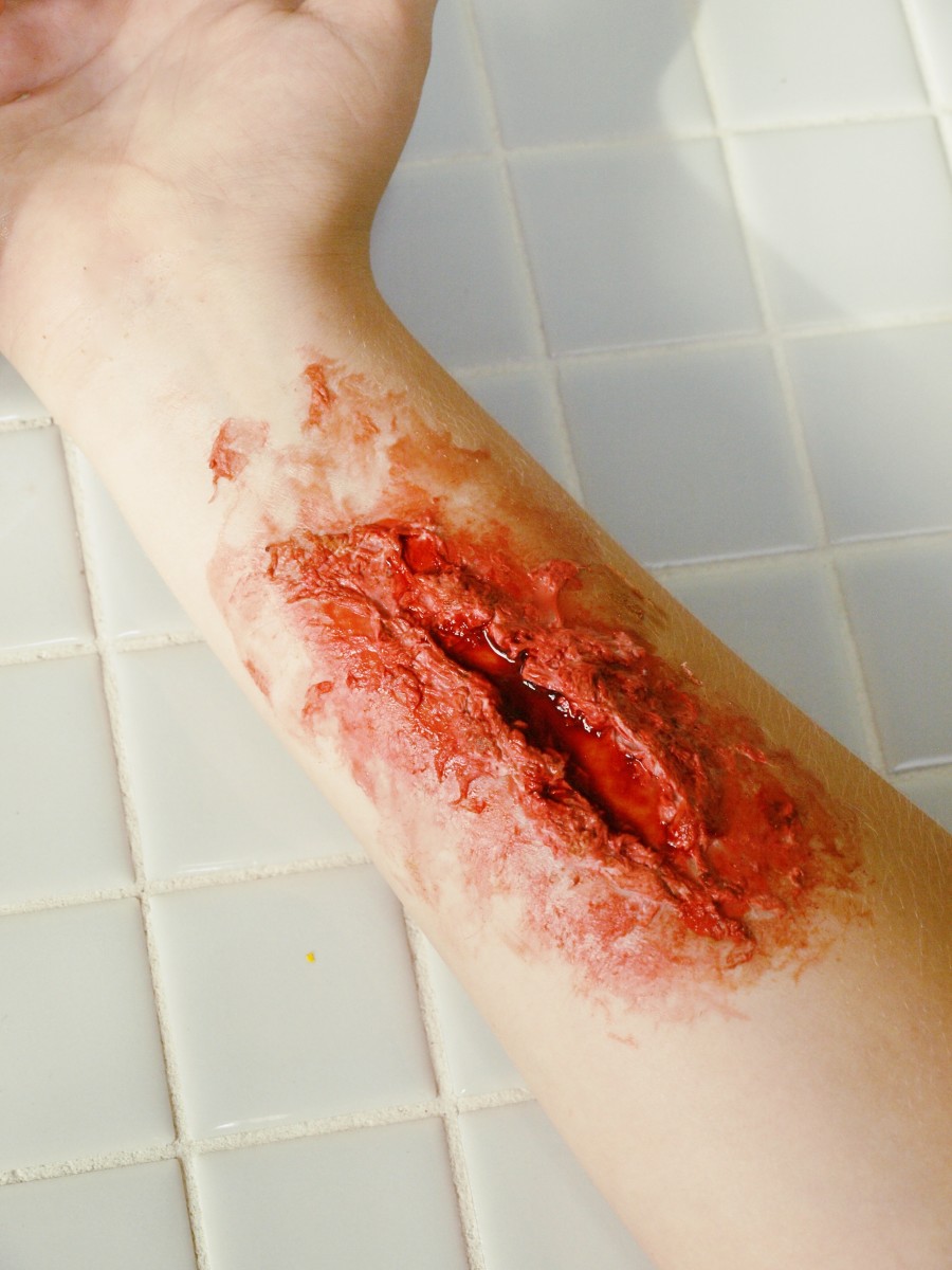 9. Gross people out with your fake wound! Dab more fake blood around the edges to give it an extra-gruesome look.