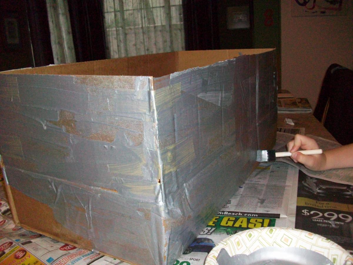 how-to-make-a-kid-s-boat-costume-out-of-a-cardboard-box-holidappy