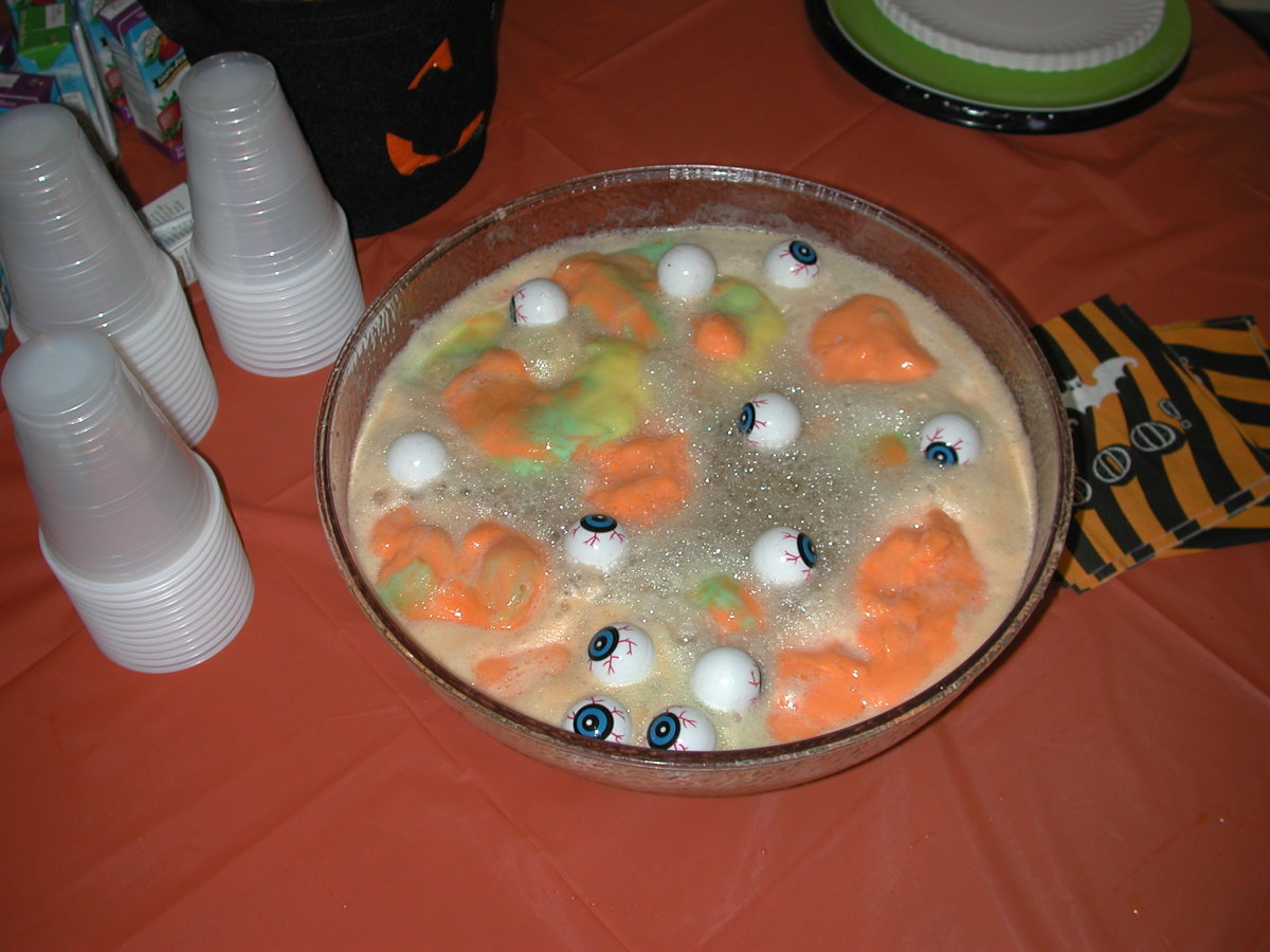 In your punch bowl, place a lot of ping pong balls that have eyes on them, sherbet, grape juice, and sprite. This makes a great drink for a Halloween Party. 