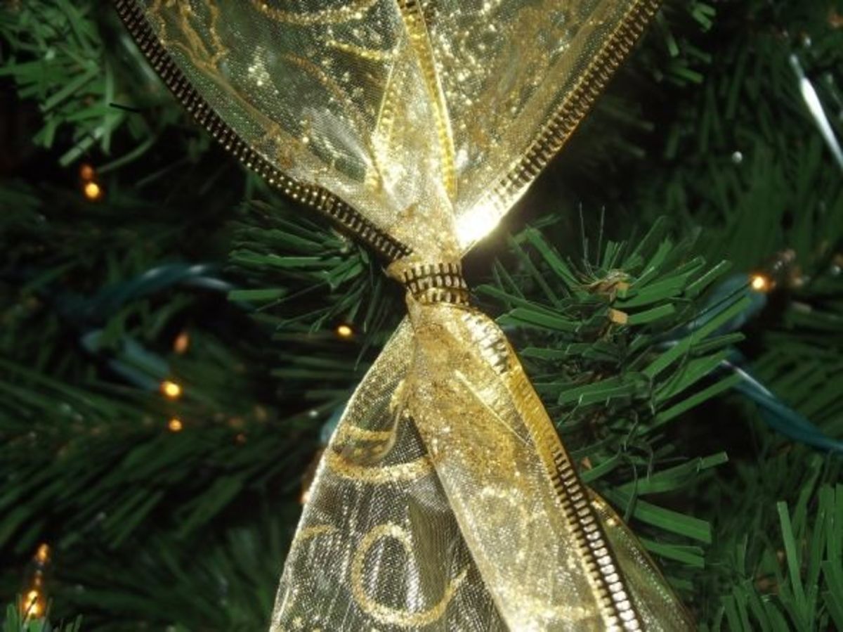 decorated christmas trees with gold ribbon