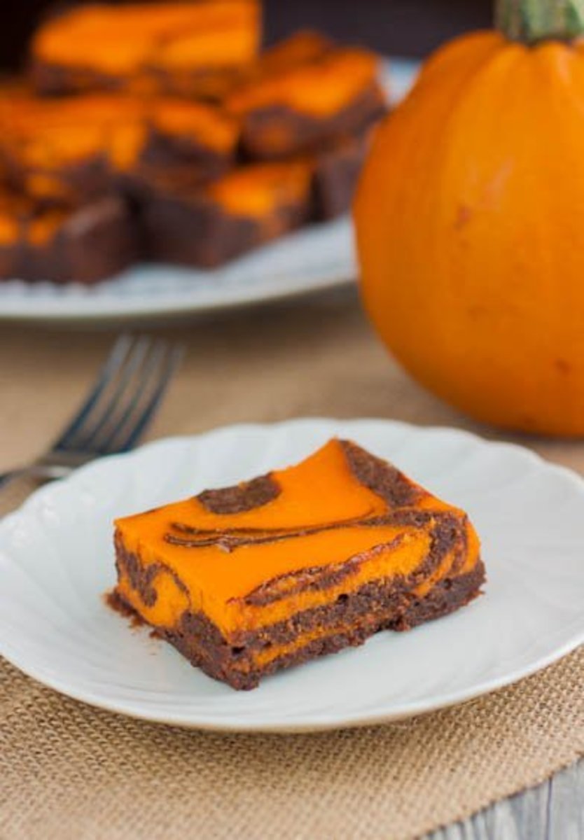 Dress up your brownies for Halloween by adding orange food coloring to the cream cheese.