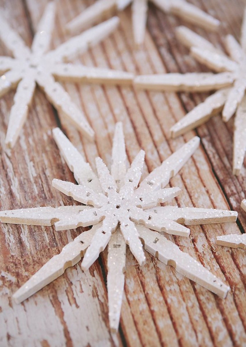 Upcycle wooden clothespins into lovely snowflake ornaments.