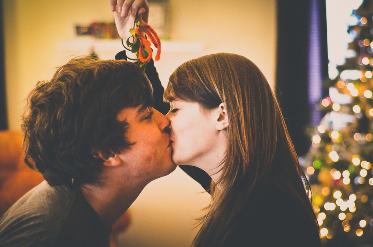 Mwah! Kisses under the mistletoe. In ancient folklore, mistletoe is associated with life giving.  It is an aphrodisiac, a symbol of fertility, and is a plant of peace under which conflicting spouses or enemies can call a truce.