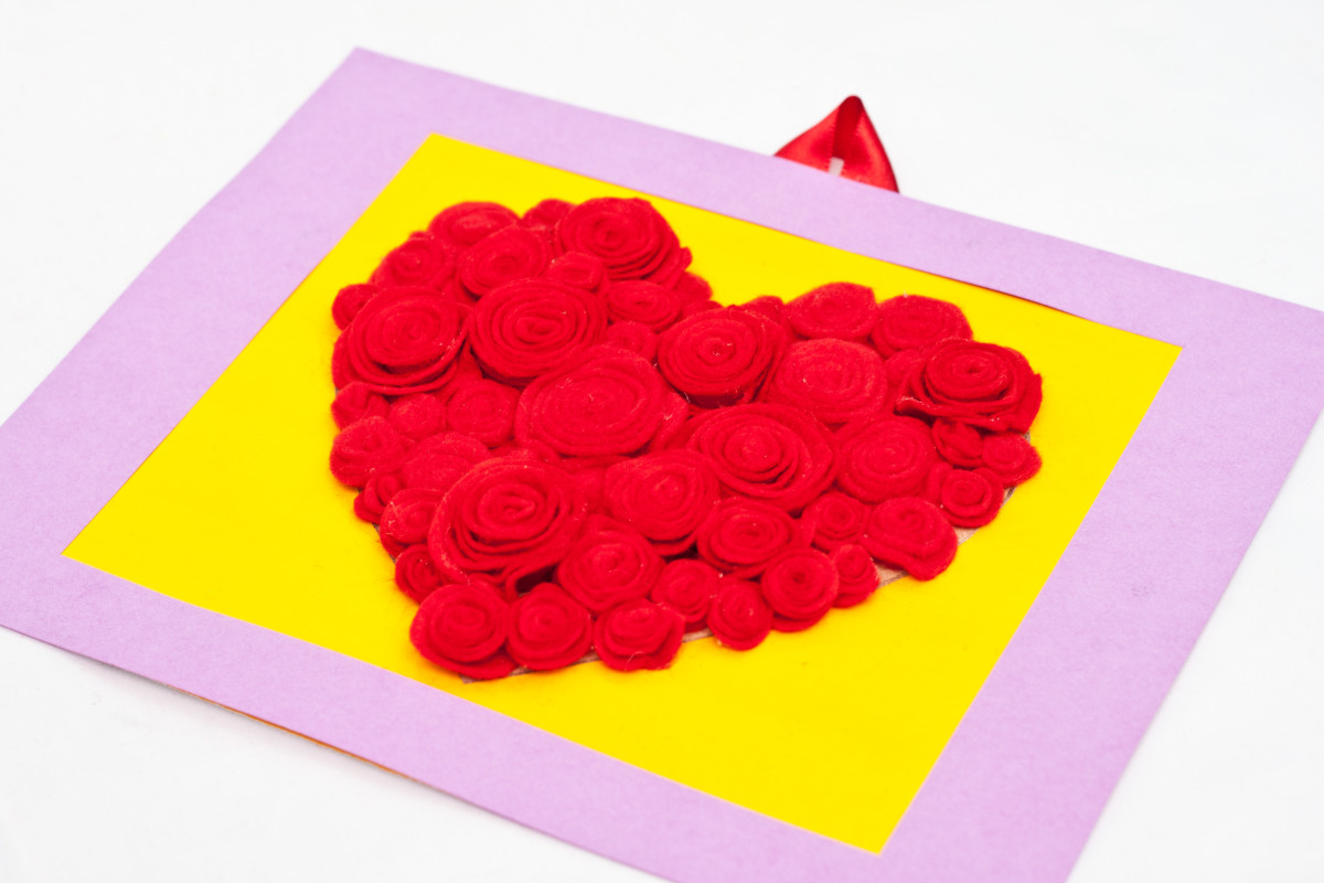 Step 13: Your heart shaped rose art is now ready to hang or be given away as a Valentine's Day gift. Now step back and take a look... your beautiful, homemade work of art is done!