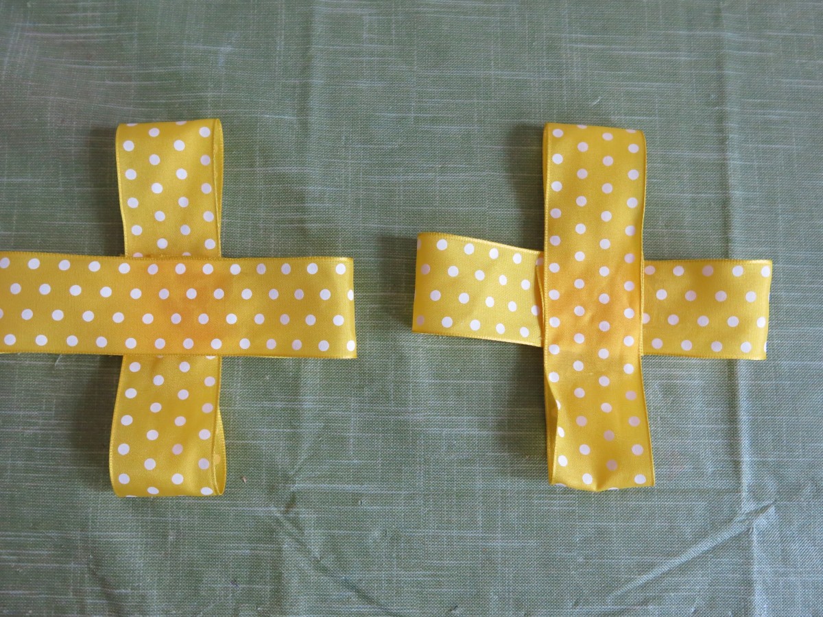 Take two of your folded pieces of ribbon and place them across the remaining pieces of folded ribbon to create two even crosses.