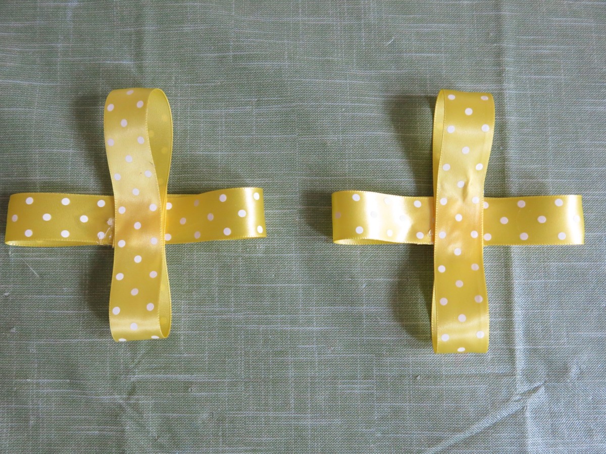 Follow steps 3–6 to fold and create two more ribbon crosses for your bow.