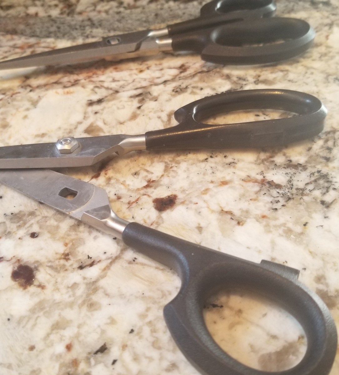 I have two pairs of Cutco Super Shears. Here is one pair separated for cleaning alongside a pair that is ready to cut.