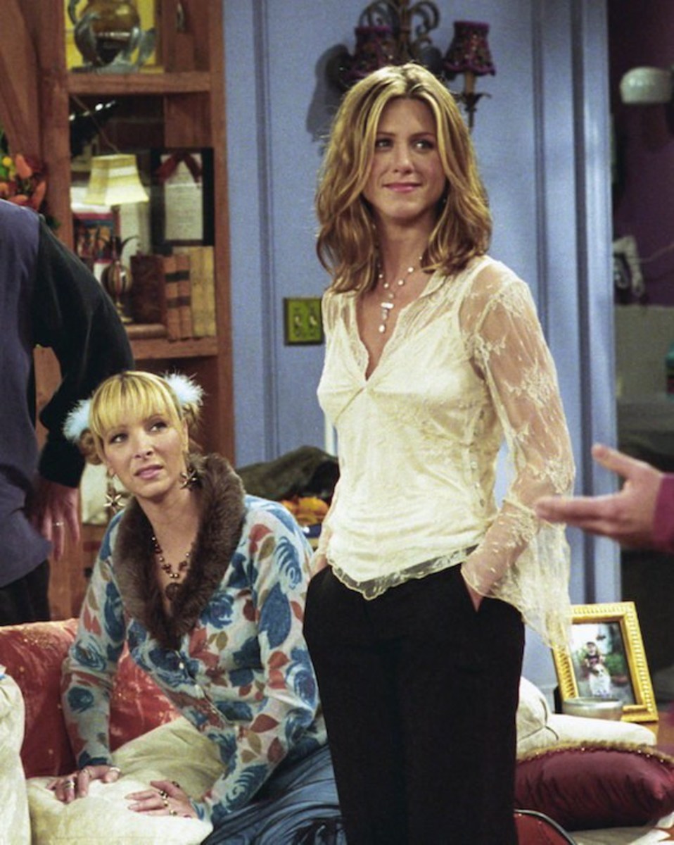 Rachel could elevate a simple look, as she did here with a white blouse and accessories. 