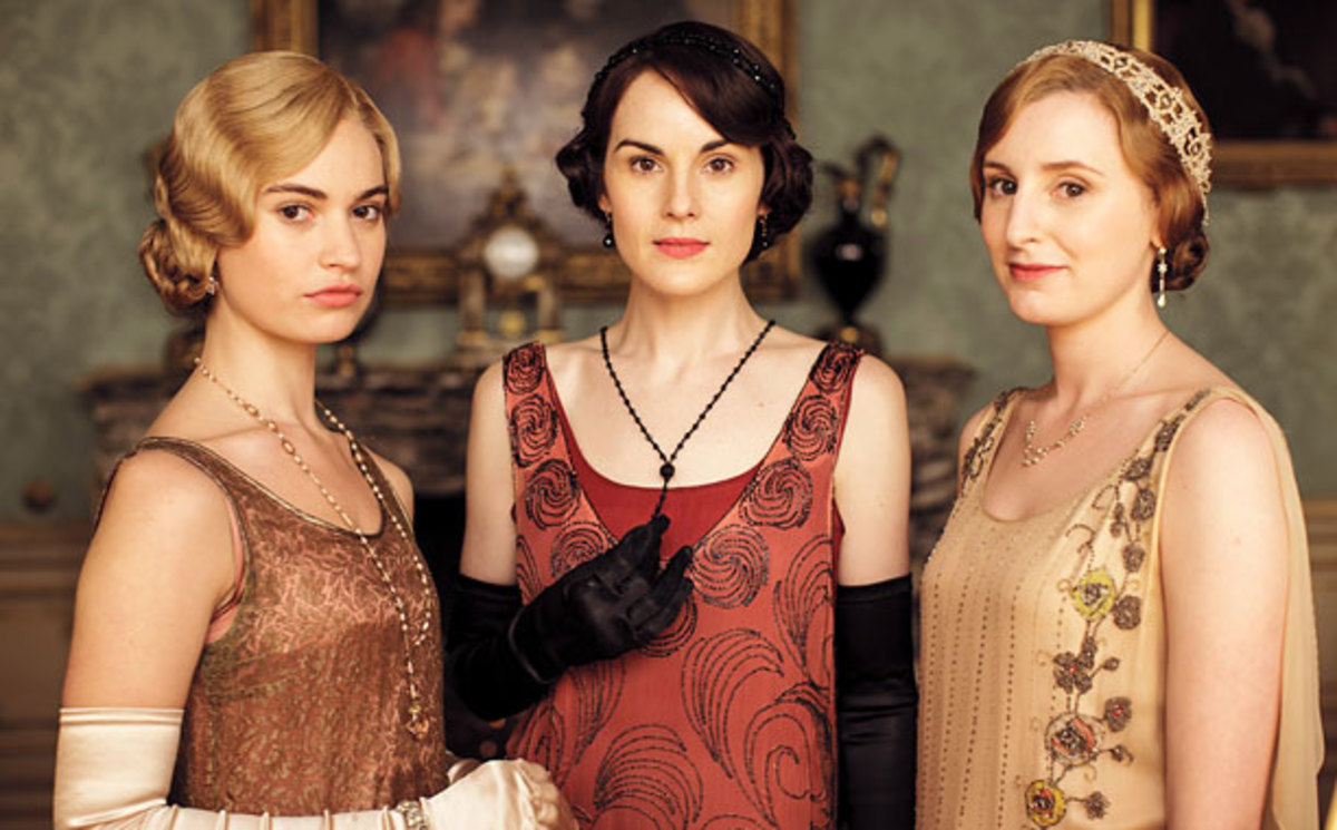 Lily James, Michelle Dockery, and Laura Carmichael as Rose MacClare, Mary Crawley, and Edith Crawley.