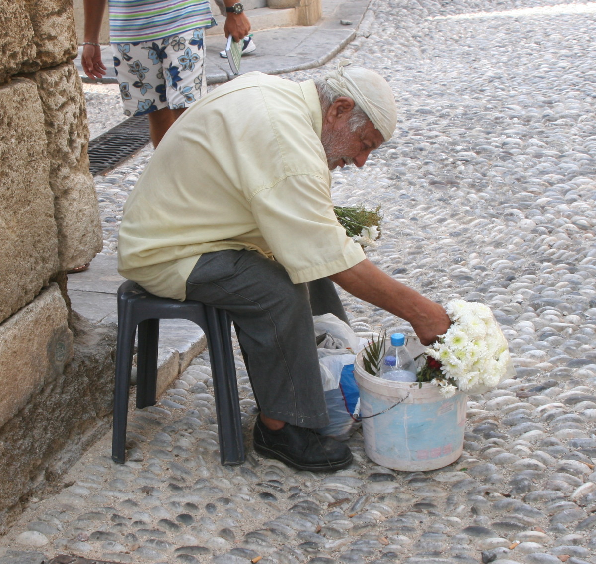 Man selling flowers in Rhodes, Greece