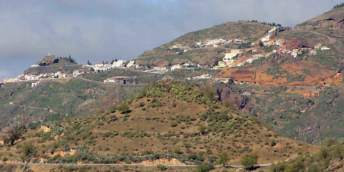 Artenaria - the highest village on Gran Canaria. The white washed walls of the houses stand out against the mountain side. See more about Artenara later in the text