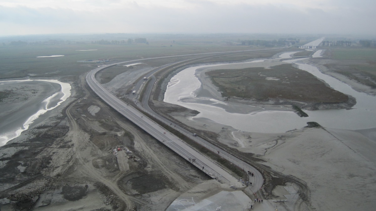 The new elevated causeway on the left.  The old causeway on the right will be removed to allow the flow of water under the new causeway.
