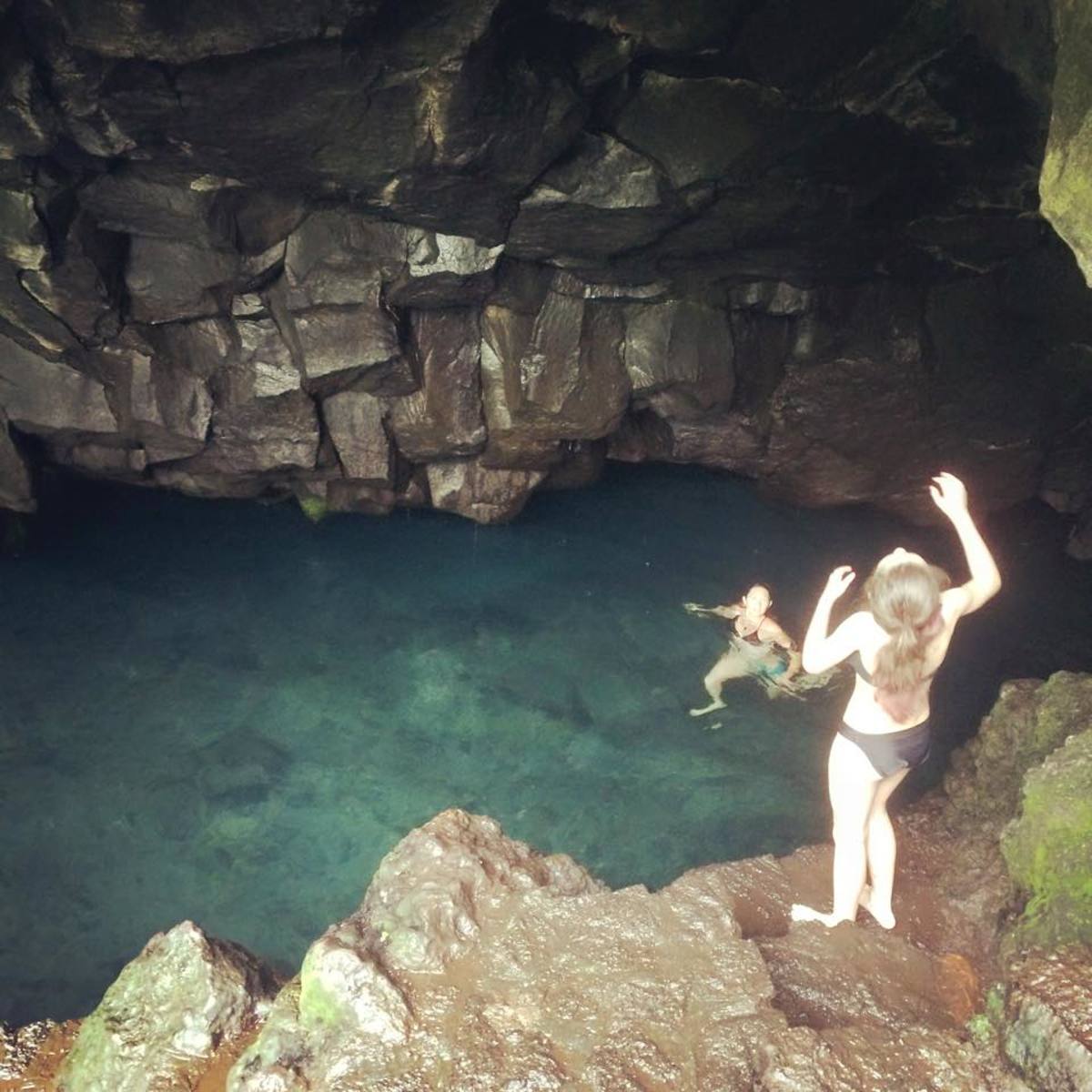Everyone had to swim under the rock wall to get to the cave and it was dark. This little girl had more guts than I did!
