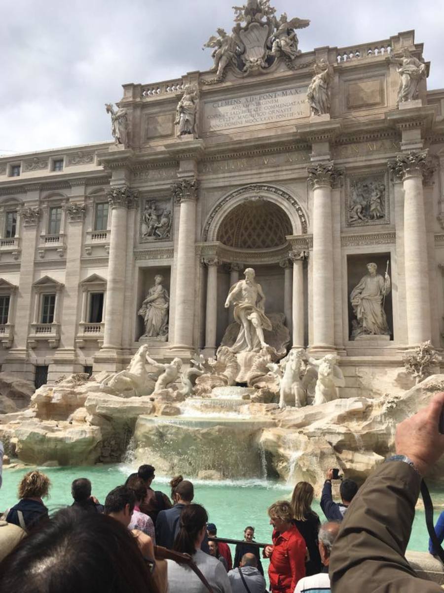 It is said that if you throw a coin into the fountain, you will return to Rome.  Needless to say, I definitely threw a coin in that fountain.