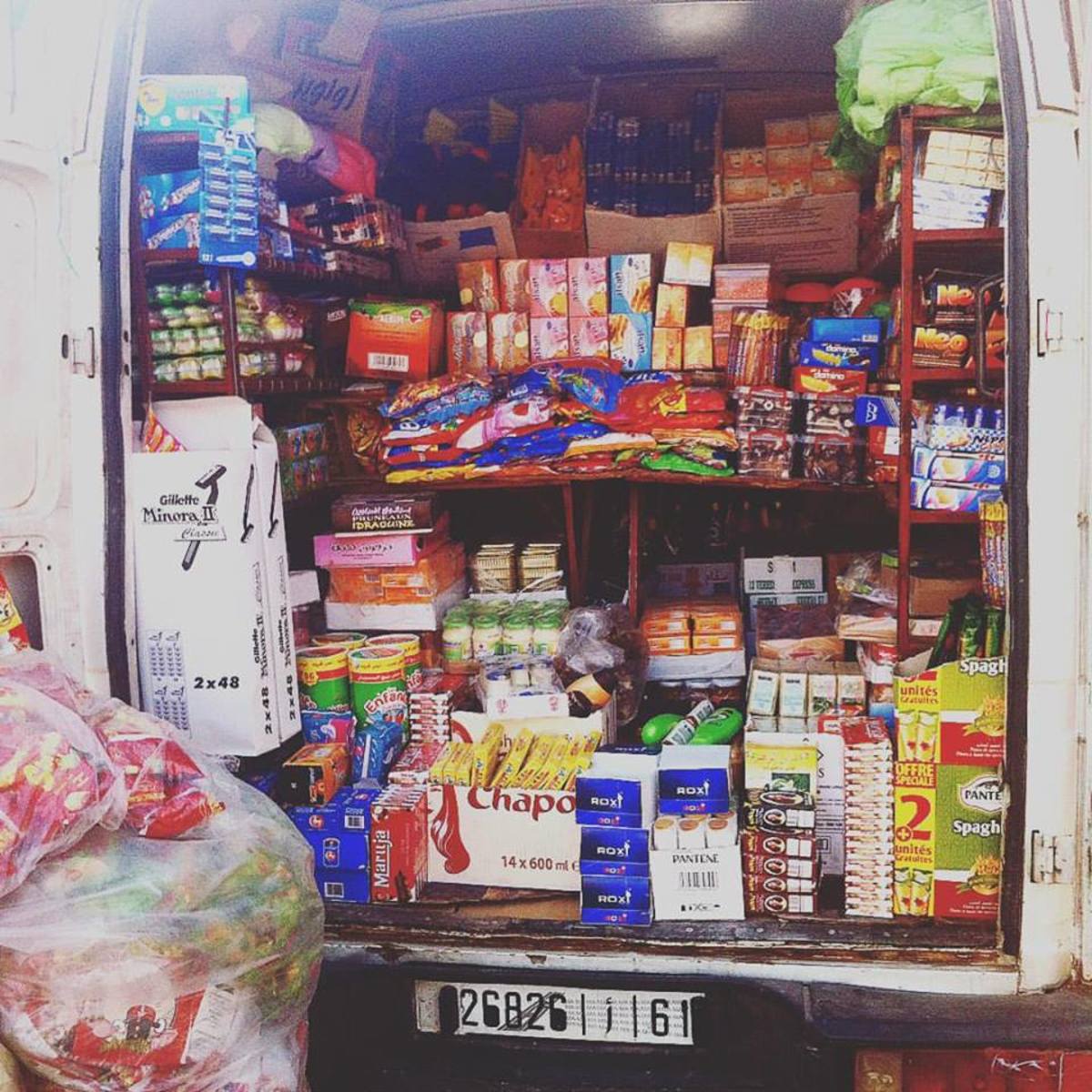 A van delivering supplies to a local shop.  