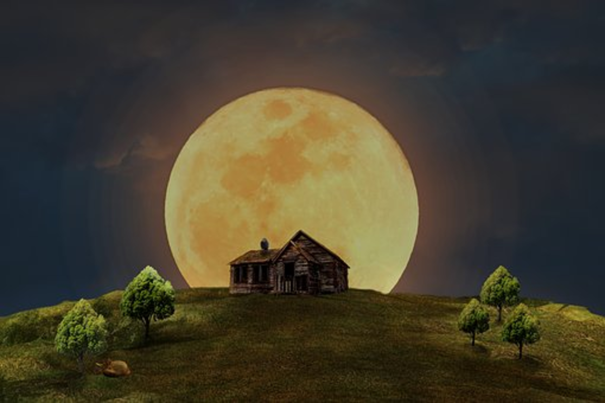 Moon shining over a home.