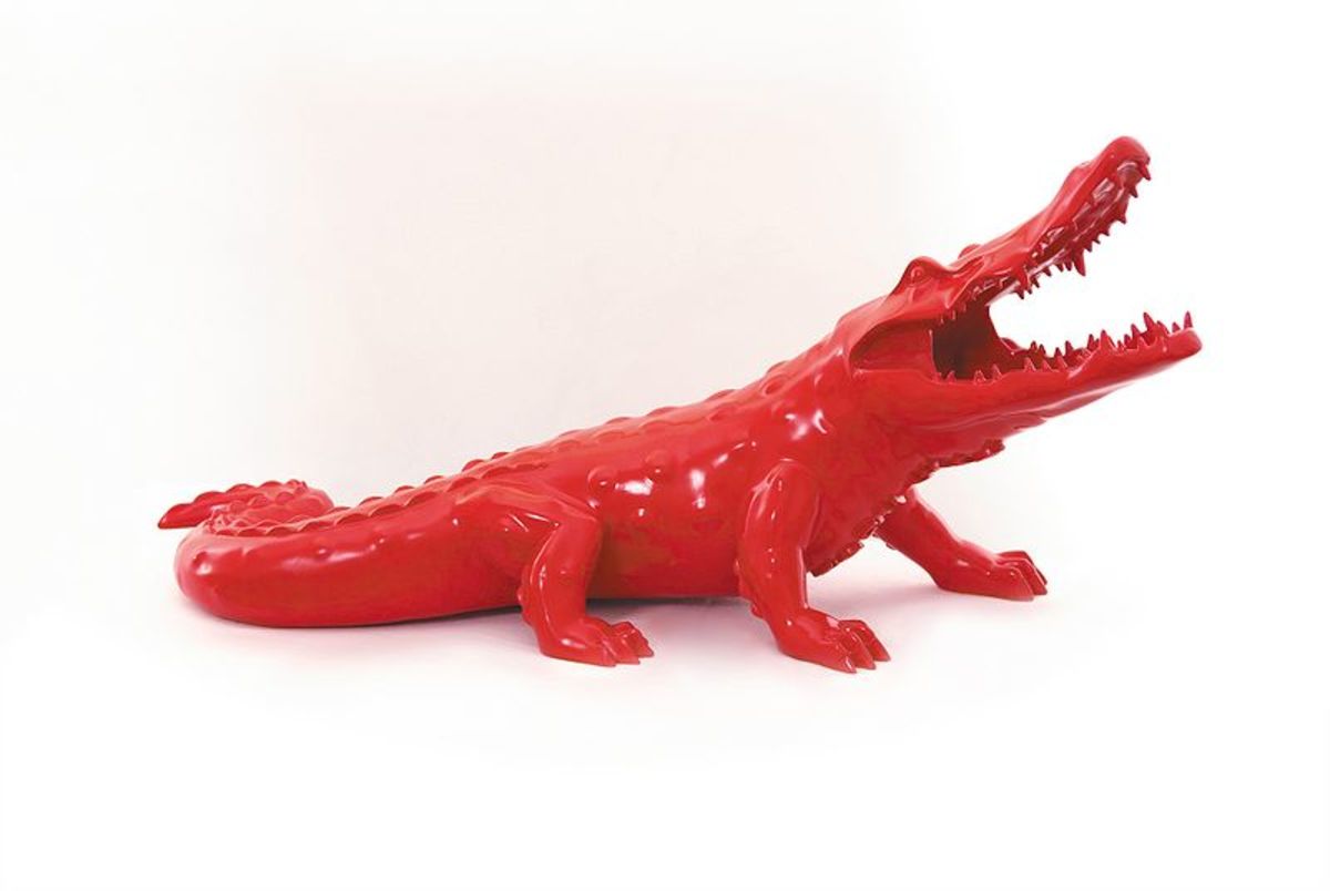 A red alligator could mean the dreamer is threatened by his urges and instinctual nature.