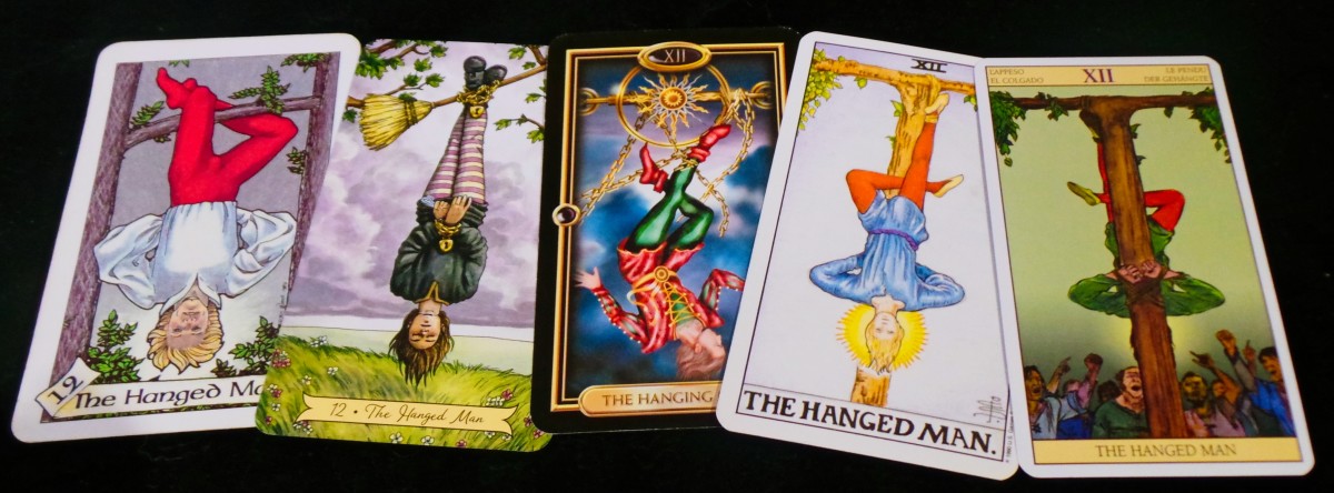 From left to right, the Hanged Man from the Robin Wood, The Everyday Witch, the Gilded Tarot, the Universal Waite and the Tarot of the New Vision.