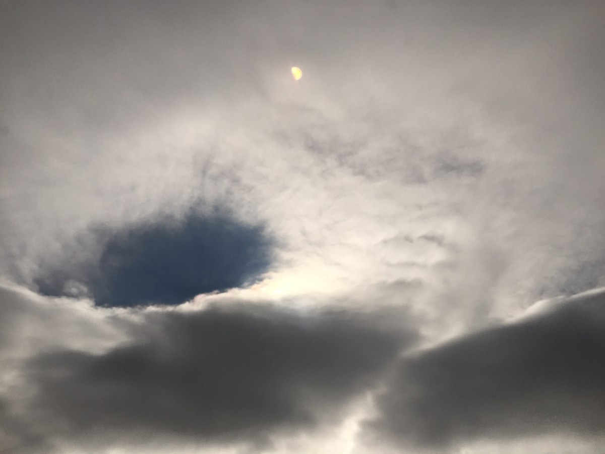 Is this an orb partially tucked behind a cloud?