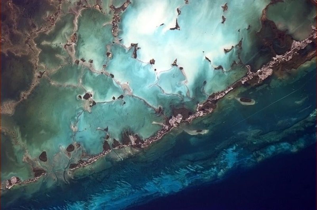 Lower Matecumbe Key to Key Largo, seen from the International Space Station.  Key Largo, as the name suggests, is the largest section of the Keys, plus the most northern of the Florida Keys in Monroe County.  It connects to the mainland via 2 routes.