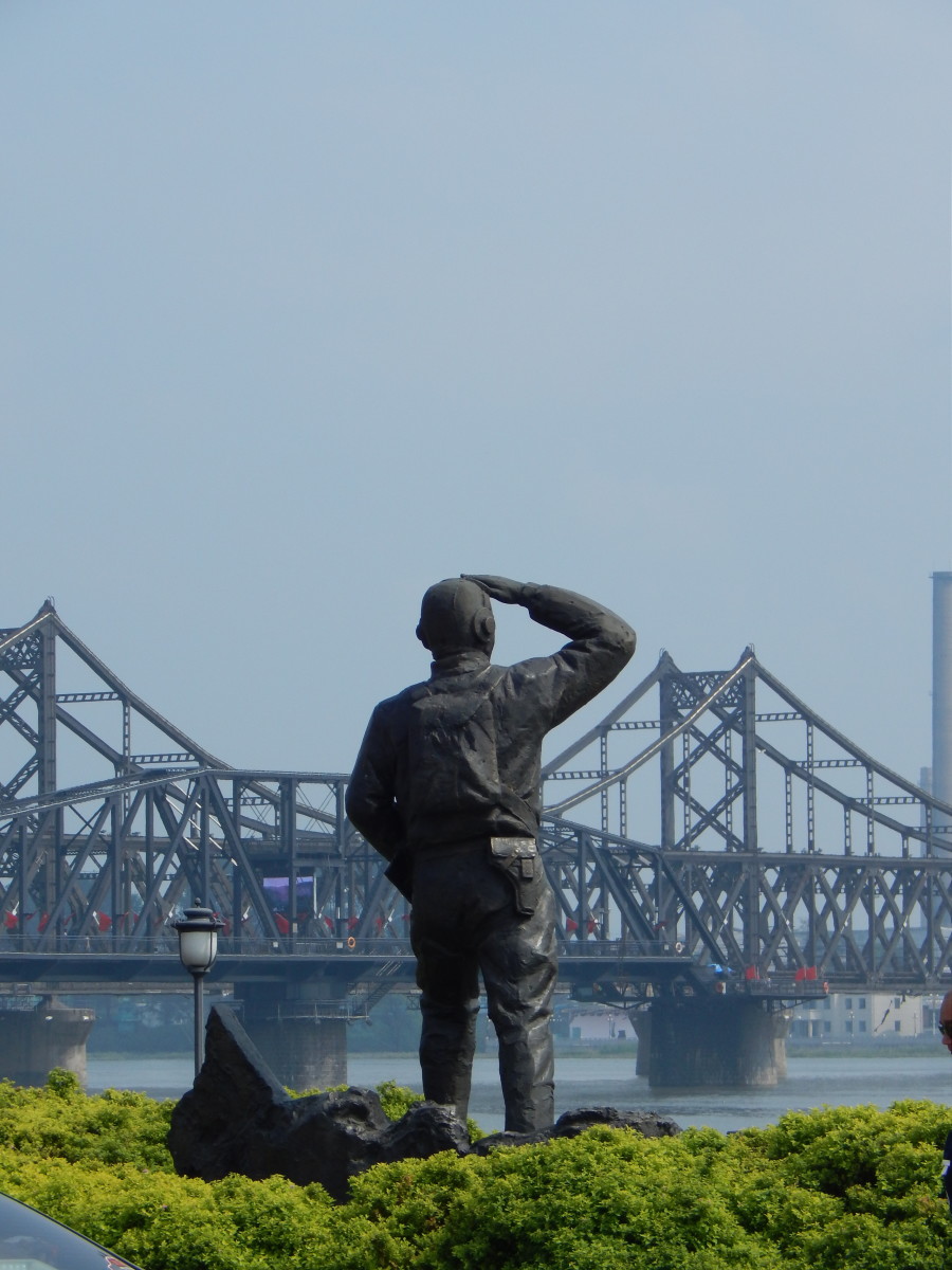 A statue overlooks the Broken Bridge. 