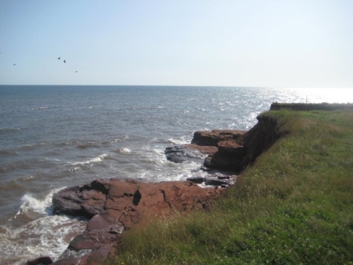 Red cliffs along the ocean in PEI, Canada.