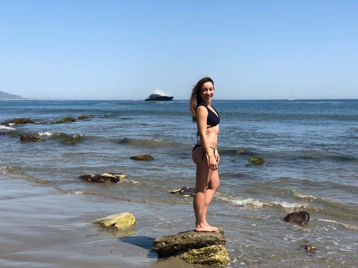 Avoiding the cold water by standing on the rocks