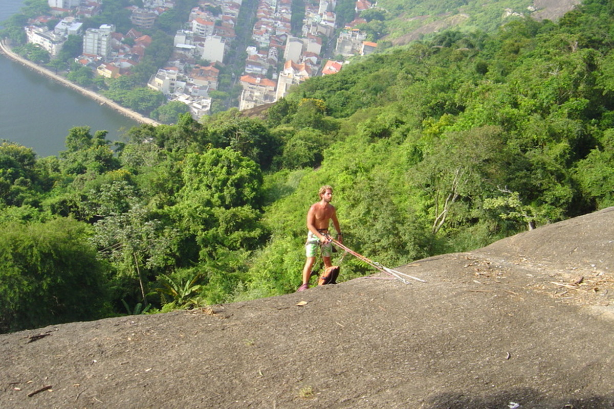 One of many athletic young people rappelling down the western side of Sugarloaf Mountain, with a fabulous view of lovely historical homes and buildings from the Portuguese colonial period.