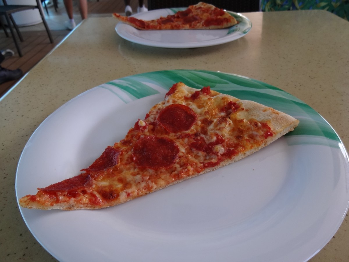 Grabbing a quick slice of pizza poolside makes the afternoon a delight.