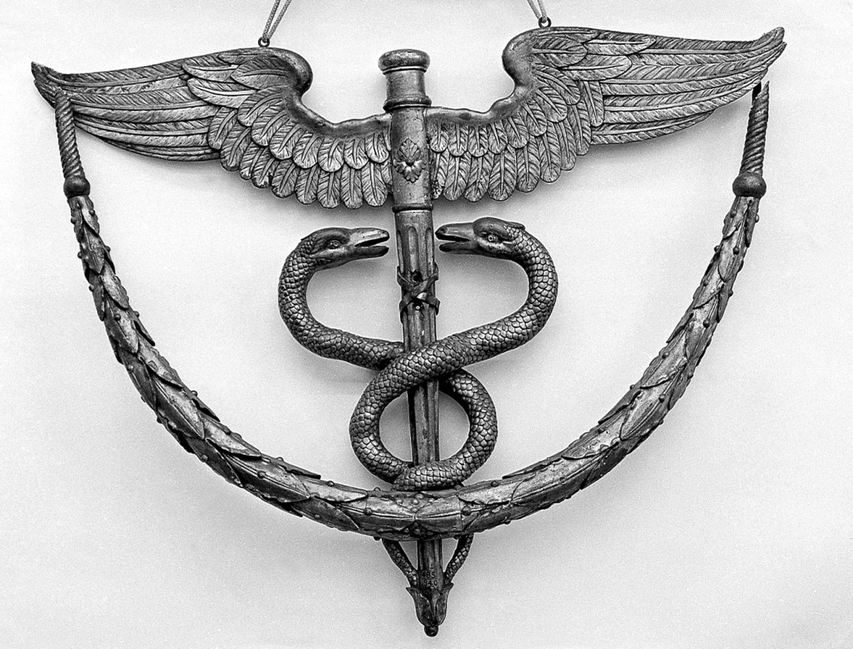 墨丘利的节杖,治疗常见医疗建筑的象征,符号,和信件。