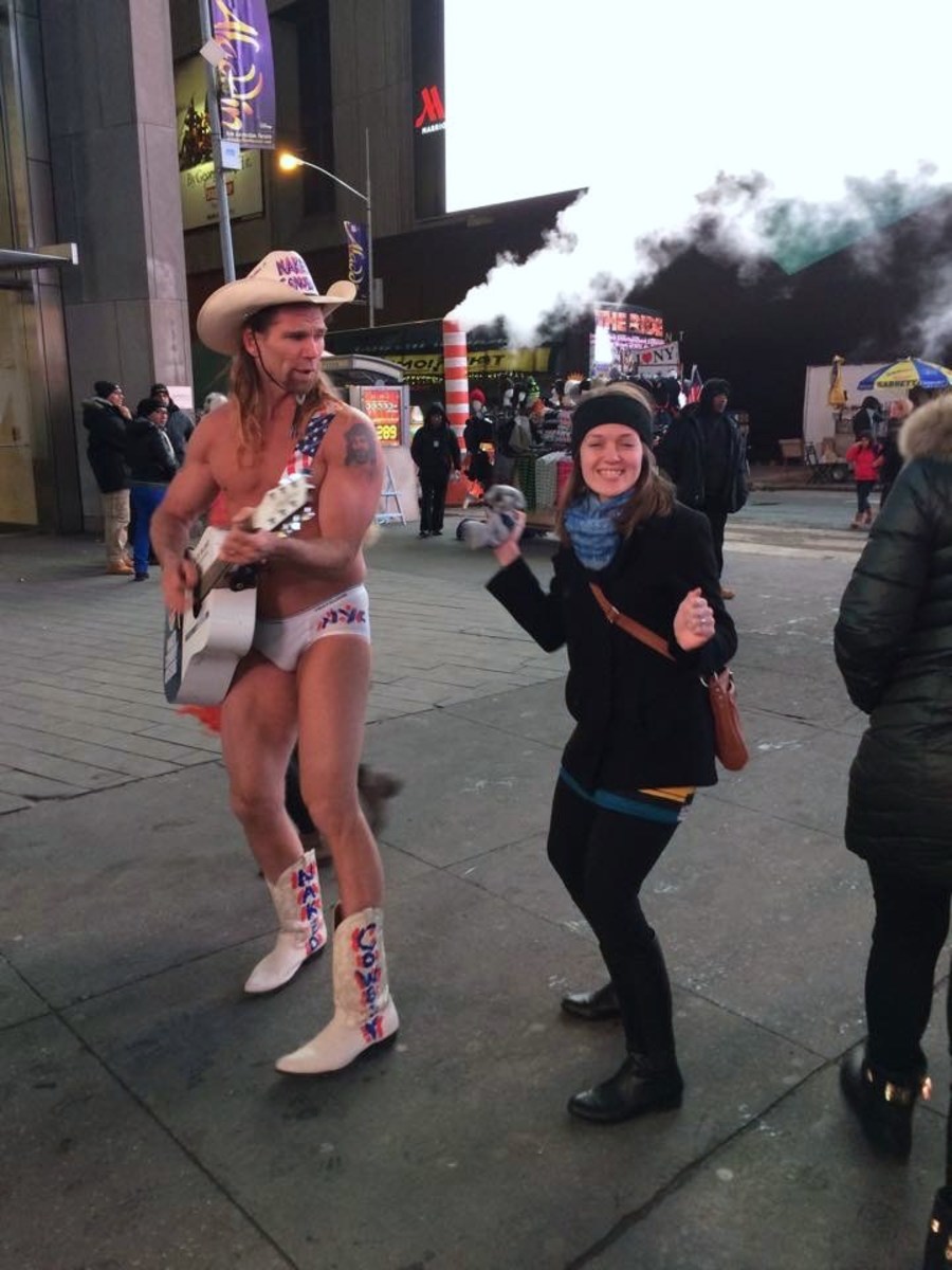 The Naked Cowboy with his guitar.