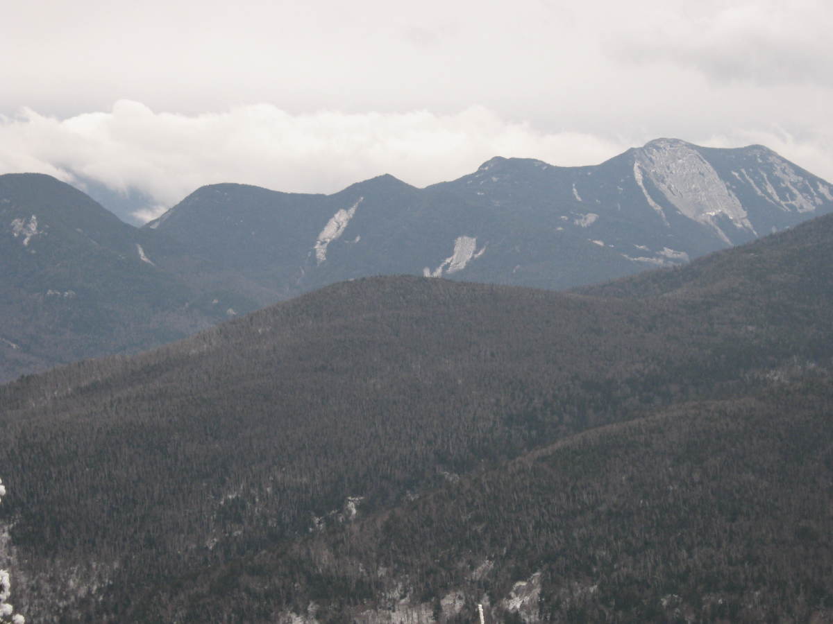 Snow clouds form over the Upper Range as seen from a lookout near the summit of Porter. 