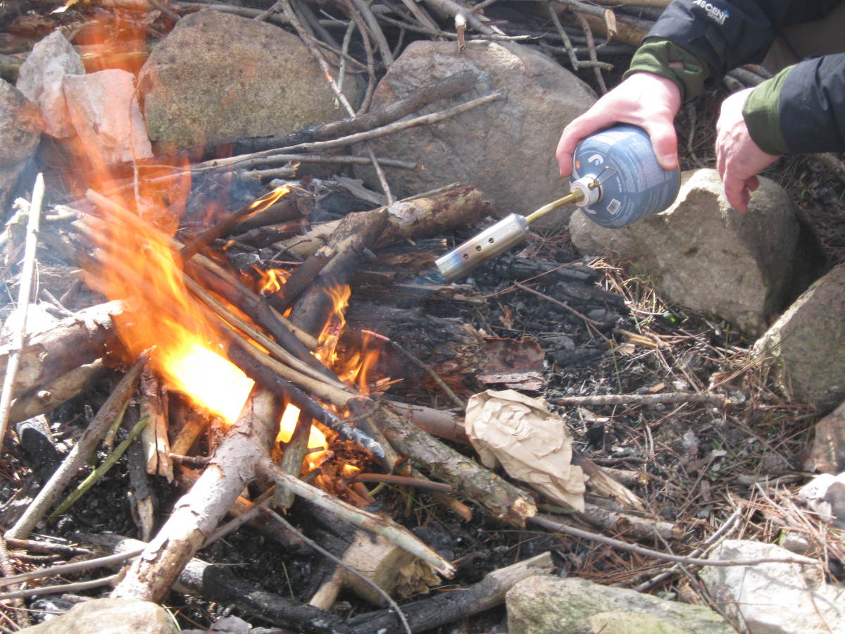 Though every outdoors enthusiast should be able to start a fire (without a torch), fires are an inefficient way of cooking.  