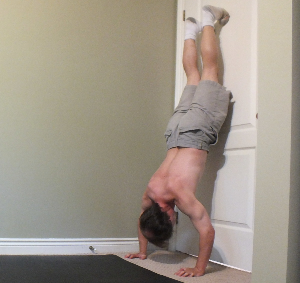 Door assisted handstand push ups.