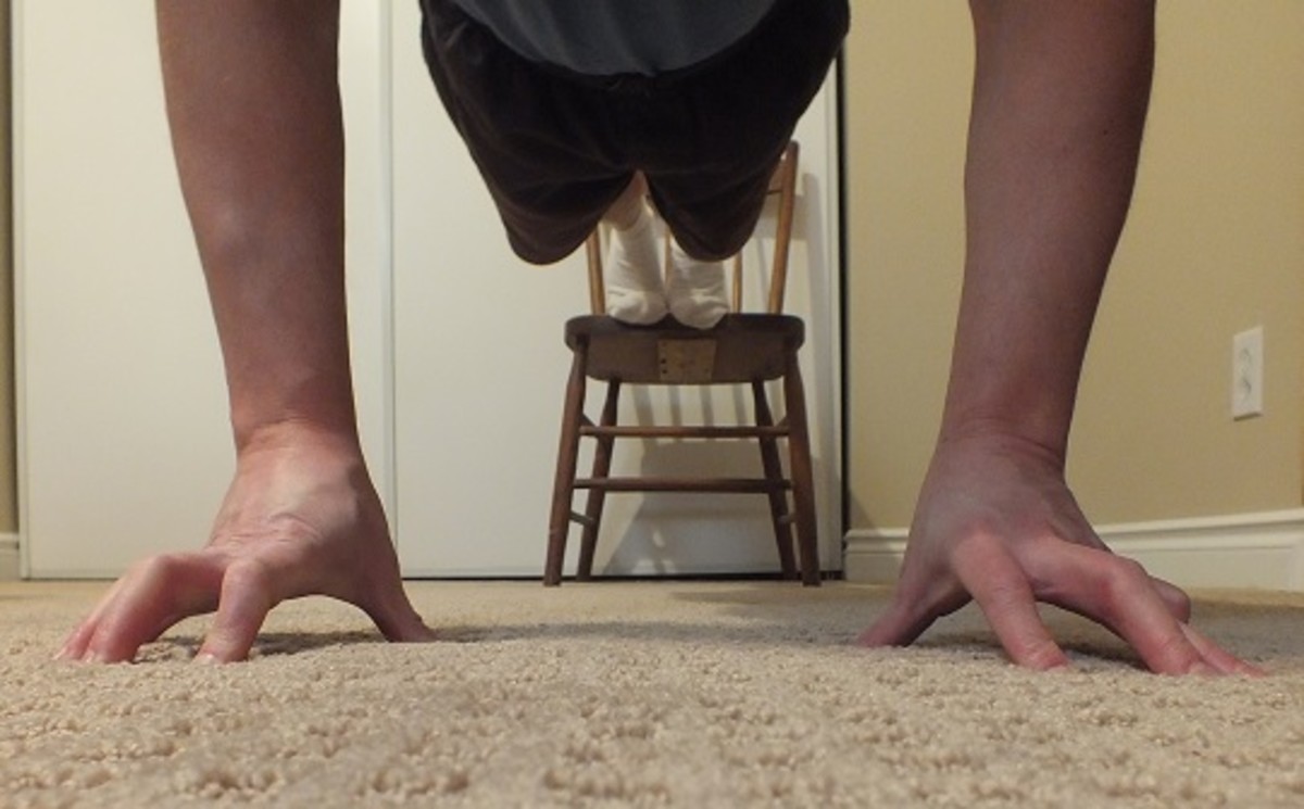 My first attempt at decline finger push ups. Raising my feet increases the weight.