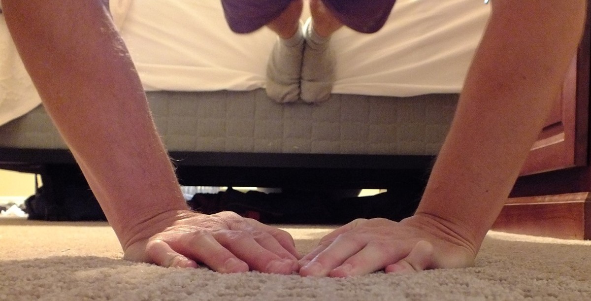 Weighted decline diamond push-ups—wearing a heavy backpack, hands close together, feet on the side on my bed.