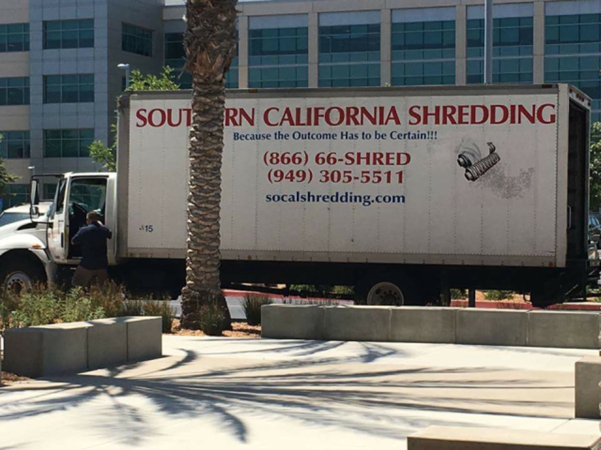 Shredding machine truck seen parked in lot of San Diego vote-counting center.