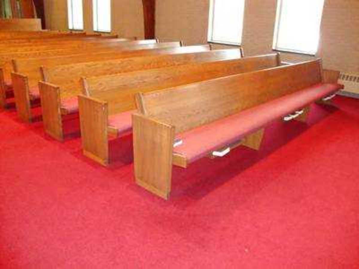 There is space underneath the first pew to store Bibles and hymnals.