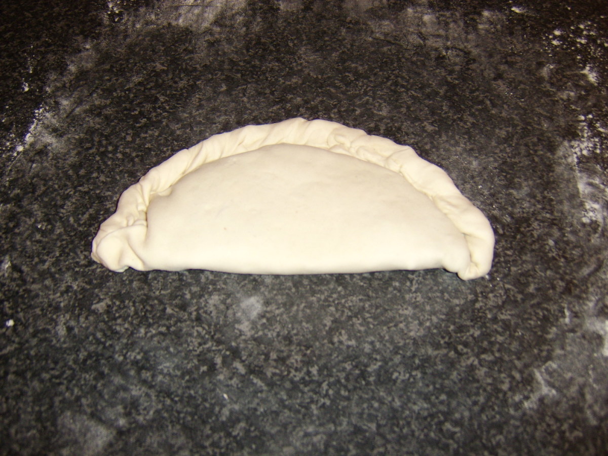 Folded and crimped pasty ready to be glazed and baked.
