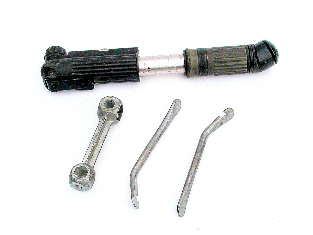 Puncture Repair Tools. A Pump, wrench for different sized nuts and tyre levers.