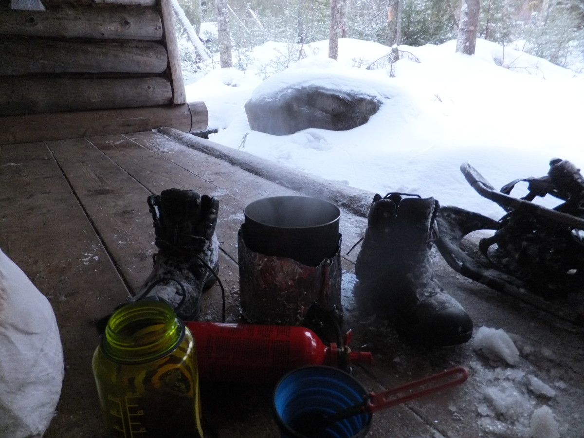 Melting snow and drying boots at McMartin lean-to. Melting snow and drying boots at McMartin lean-to.