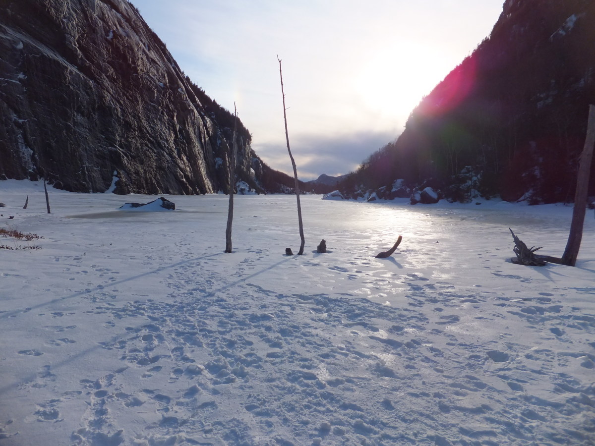 Looking south toward a setting sun at Avalanche Lake. Looking south toward a setting sun at Avalanche Lake.
