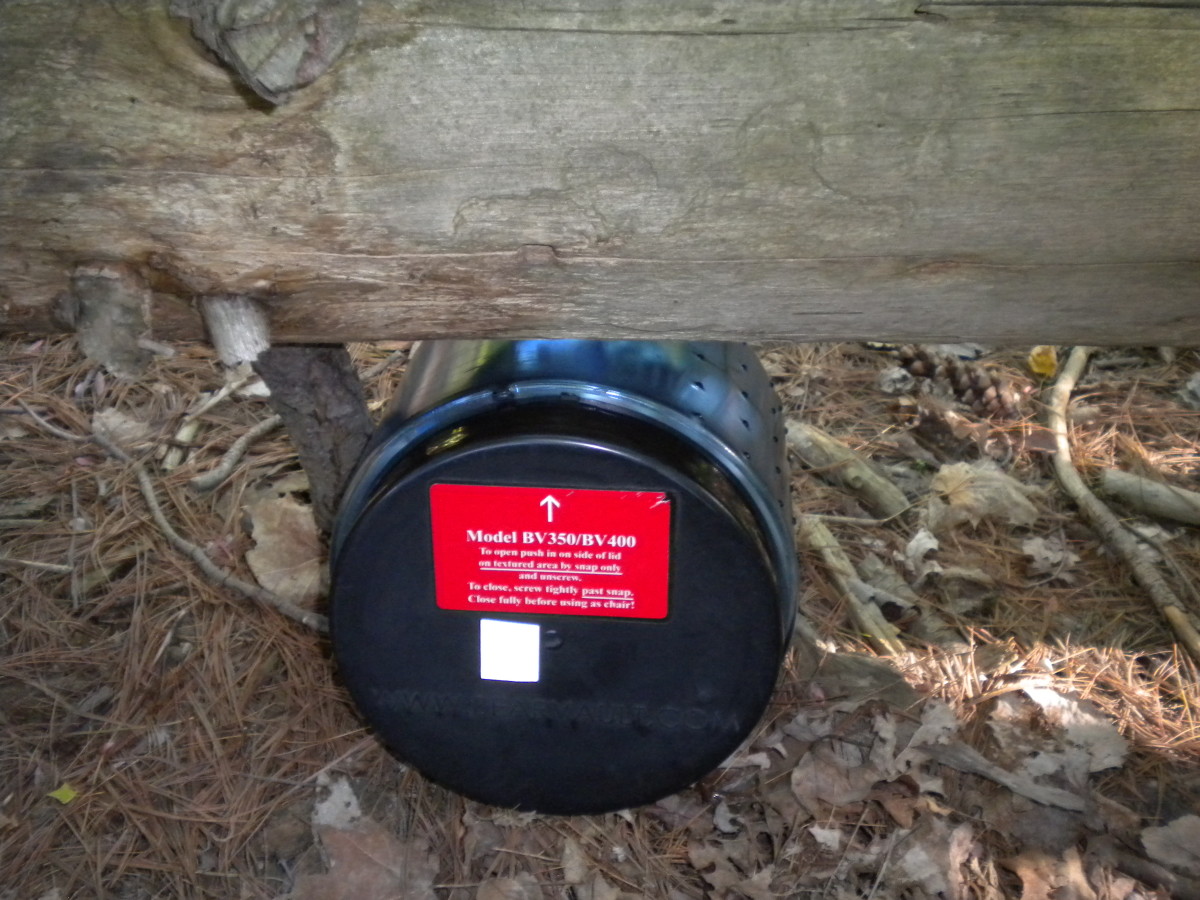 Stop bears from rolling your canister around at night by wedging it under a log. 