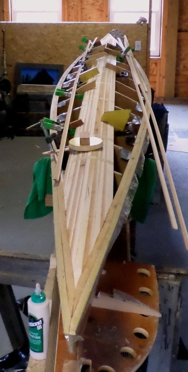 building-a-cedar-strip-kayak-the-details-exterior-fiberglass-and-planking-the-deck
