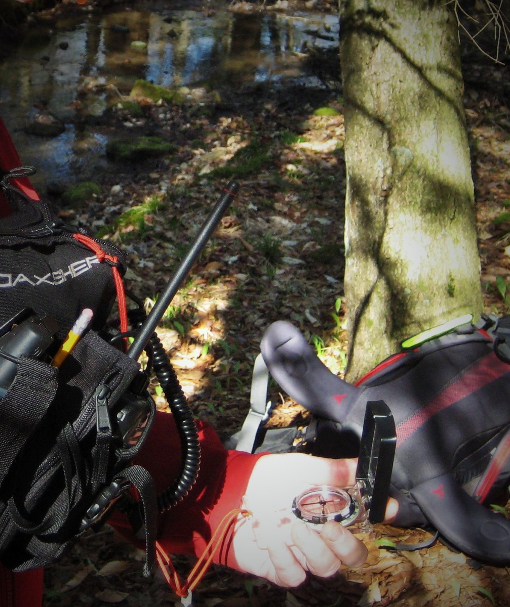 Navigating by compass on a search and rescue orienteering course.  