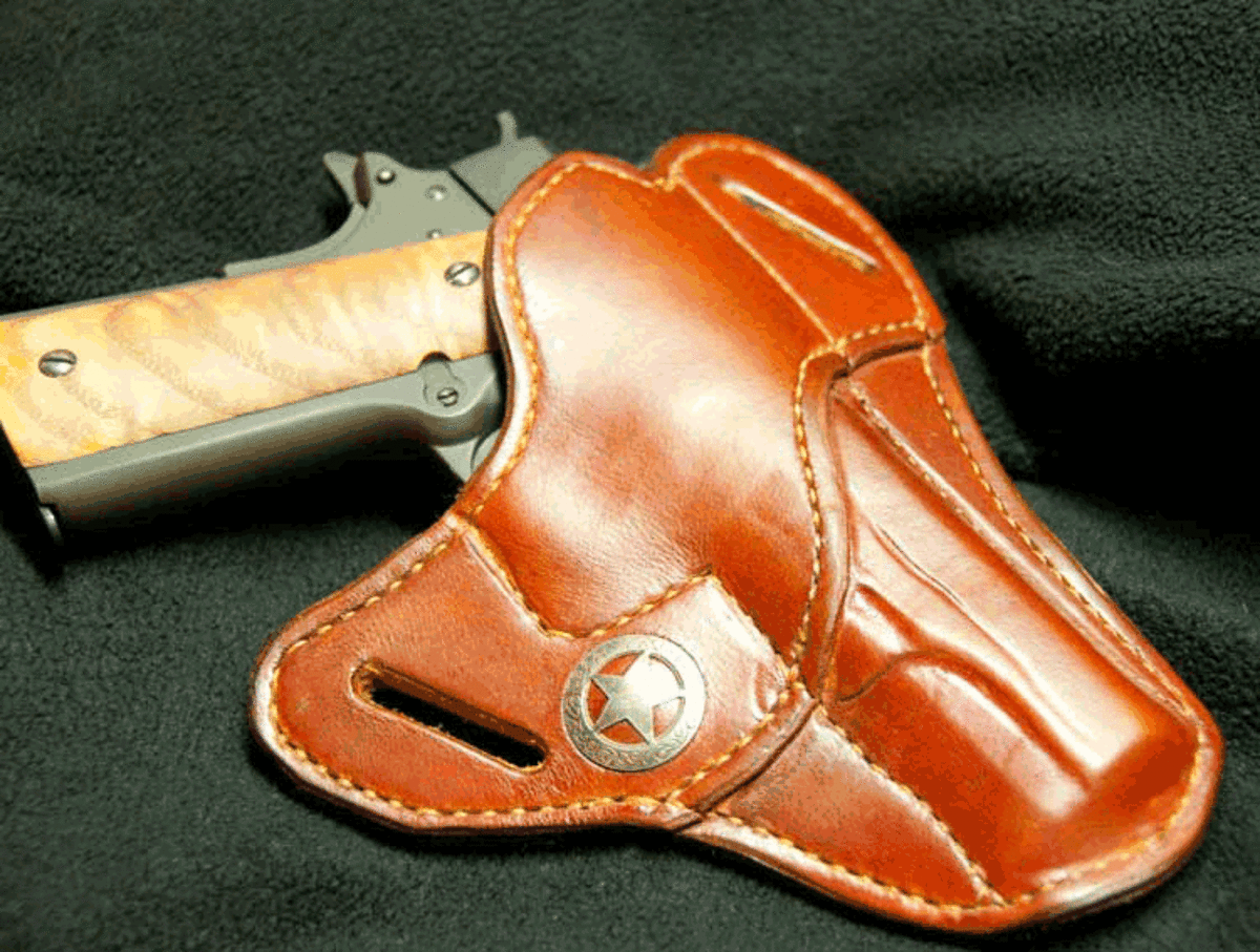 This pancake-style holster is a comfortable way to carry even full-sized pistols, but it lacks any mechanical retention device.  According to Hightshoe, it is not a good choice for secure open carry.
