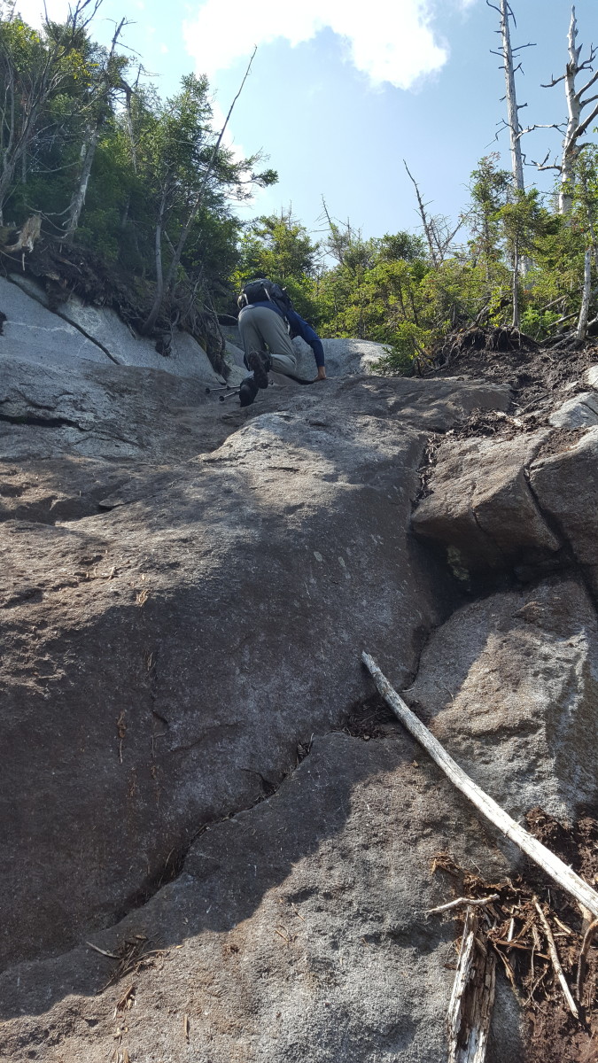 Tough Ascent on Cliff