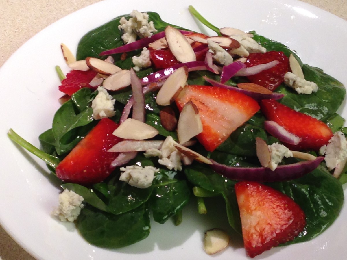 Green salad with strawberries- berries are good sources of anthocyanins