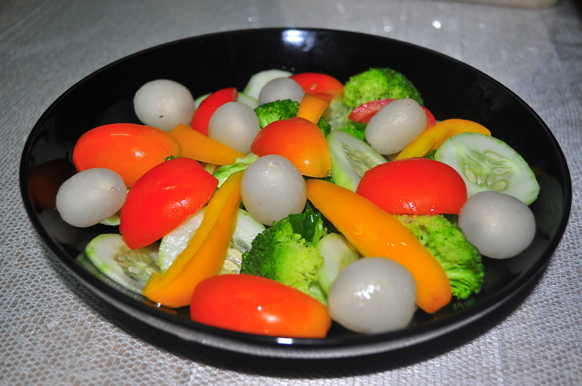 Cucumber, broccoli, tomato, yellow pepper and rabutan fruit (the white grape like balls).