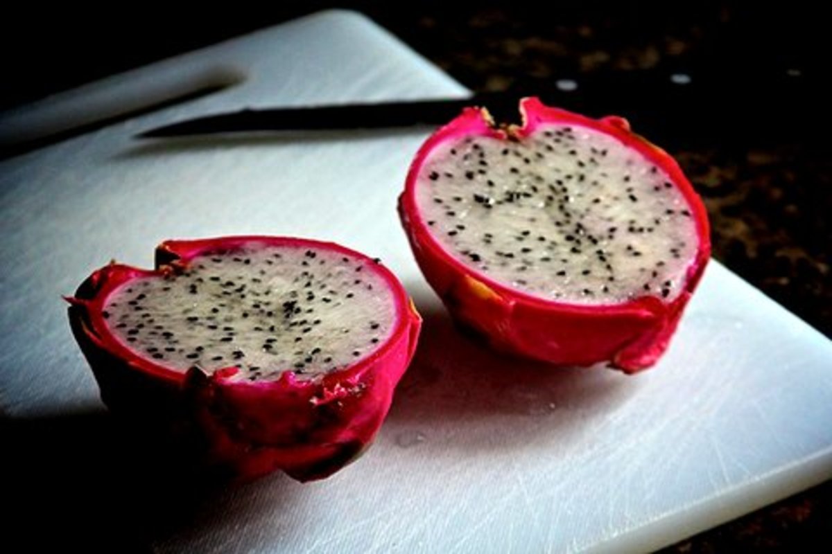 One way to eat the dragon fruit is to cut it half lengthwise and scoop the flesh with a spoon